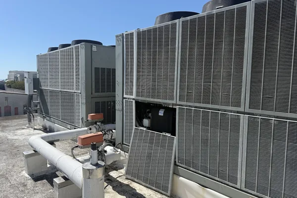 A bank of commercial condensing units on a rooftop