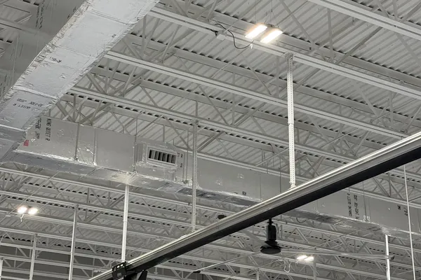 Insulated ductwork and lighting across an open commercial ceiling