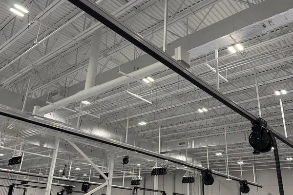 Ductwork above a fitness facility floor