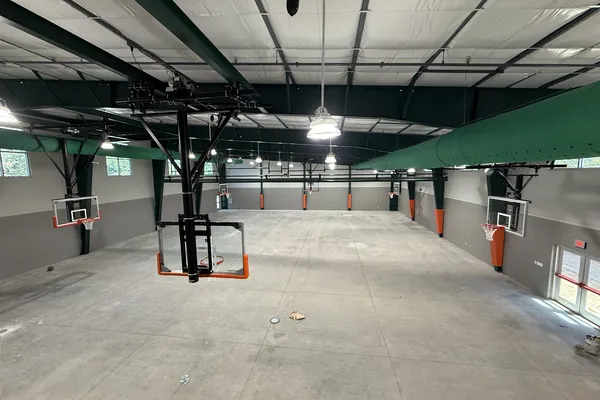 Fabric duct and lighting above an indoor basketball court