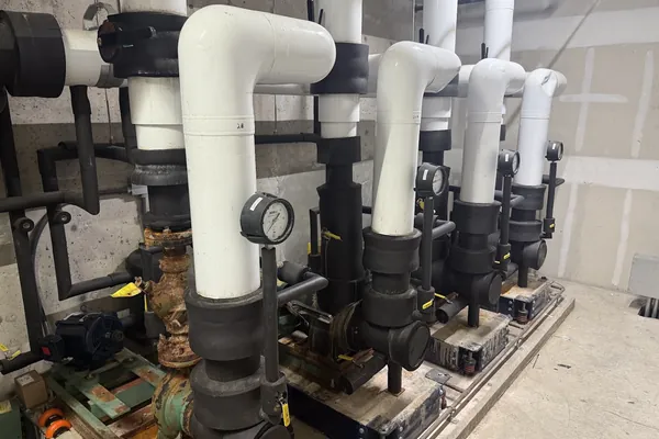 Insulated pump and piping manifold in a mechanical room
