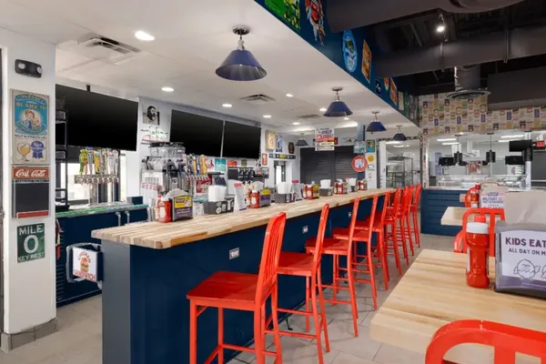 Ductwork above a restaurant bar and counter seating