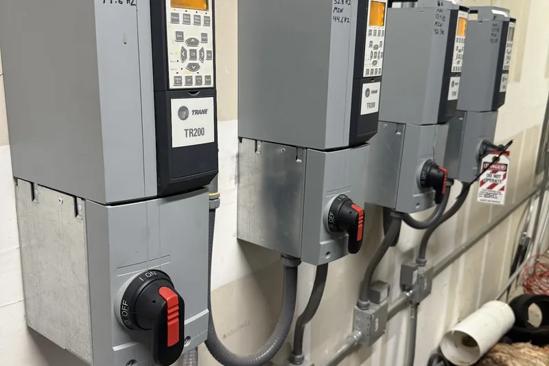 Commercial HVAC work by Climatech of Professional Air &mdash; Trane TR200 variable frequency drives mounted in a mechanical room