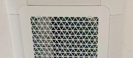 Samsung ceiling cassette indoor unit installed in a white ceiling