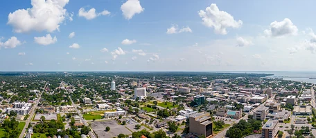 Aerial view of the coastal downtown and waterfront in the Climatech of Professional Air service area